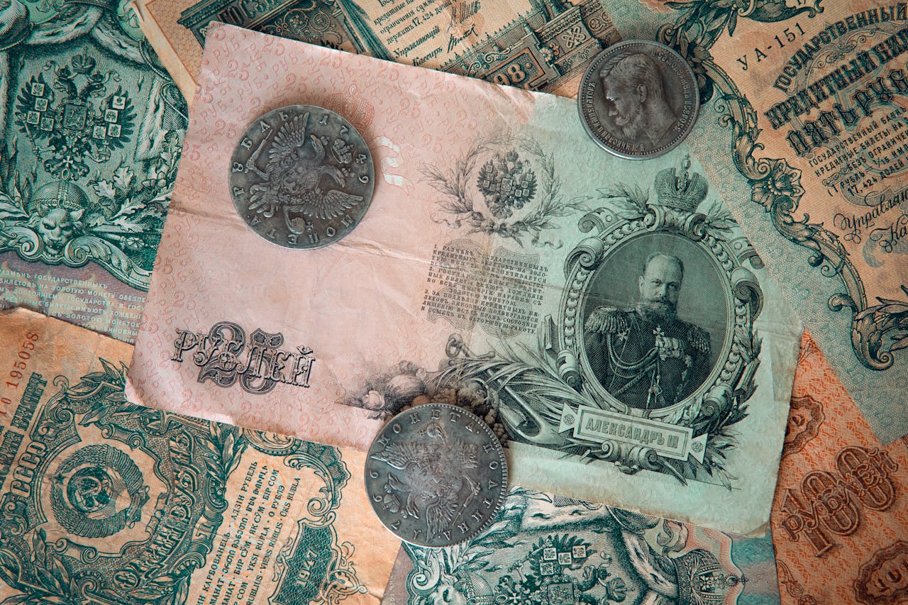 A detailed image of antique Russian banknotes and coins from the Tsarist era, showcasing historical wealth.